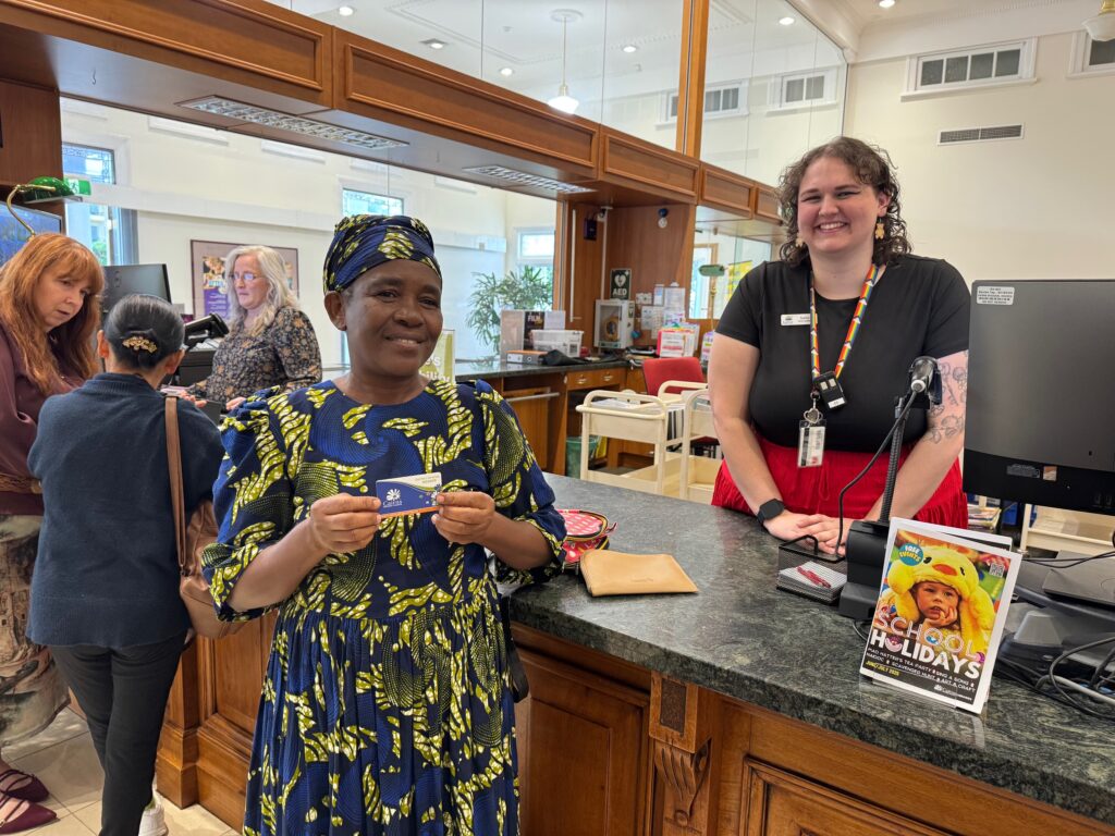 SEE participant getting their library card from Cairns library staff.