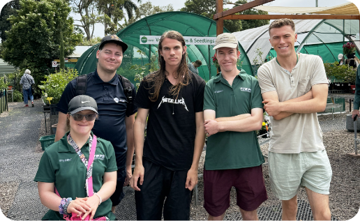 STEPS Garden Centre staff and volunteers smiling.