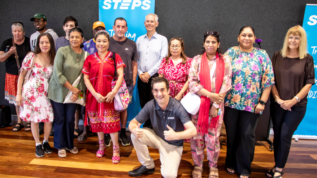 Several STEPS SEE Program participants in Darwin pose for a photo with The Hon Andrew Giles MP, Minister for Skills and Training.