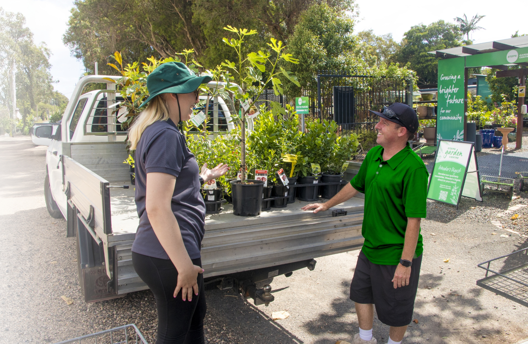 STEPS Garden Centre staff helping load a bulk order onto the back of a Ute.