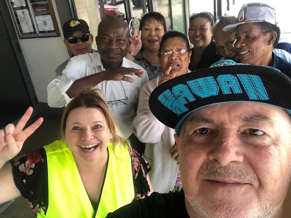 STEPS volunteer Jurgen and SEE participants smiling.