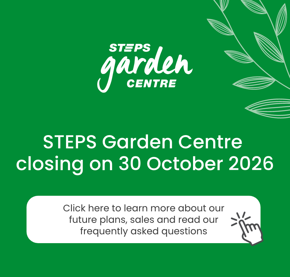 A wide green promotional banner featuring the STEPS Garden Centre logo in the top left corner within a light grey curved shape. Large white text in the centre reads, “STEPS Garden Centre closing on 30 October 2026.” Beneath the headline is a rounded light grey call-to-action button containing the text, “Click here to learn more about our future plans, sales and read our frequently asked questions.” A hand-click icon appears beside the button, reinforcing the interactive nature of the banner. Decorative leaf illustrations run vertically along the right edge of the design. The colour palette is primarily green, white and grey, consistent with STEPS Garden Centre branding.