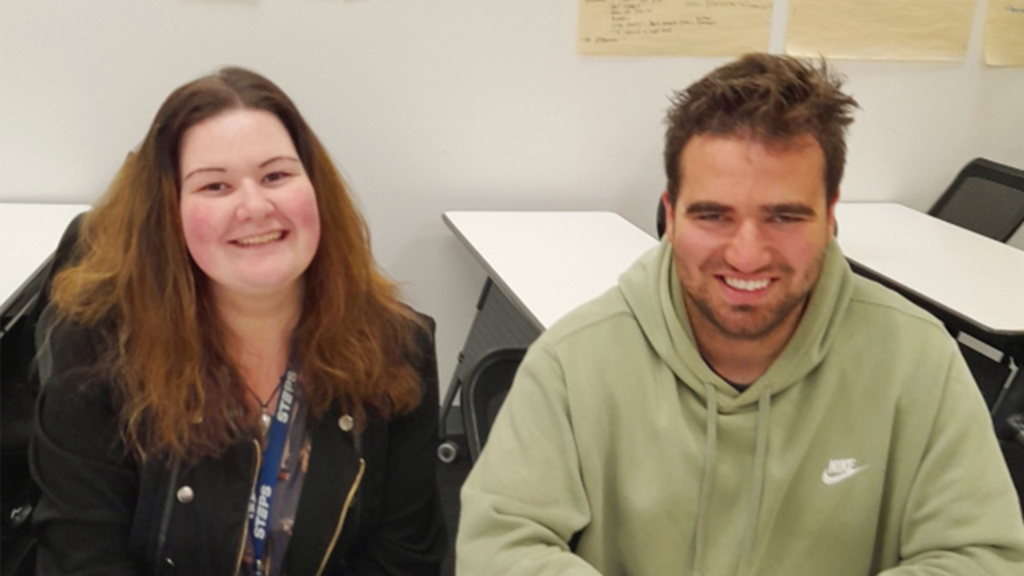 STEPS Work Mates Trainer [L] sits next to Work Mates client Niko [R] at STEPS Hobart site.