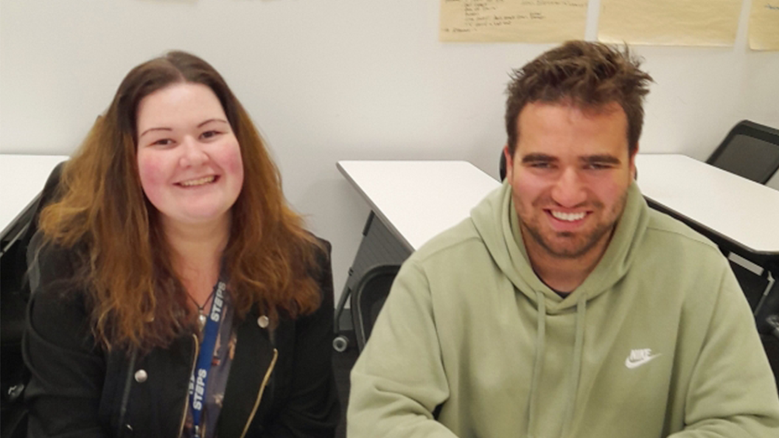 STEPS Work Mates Trainer [L] sits next to Work Mates client Niko [R] at STEPS Hobart site.