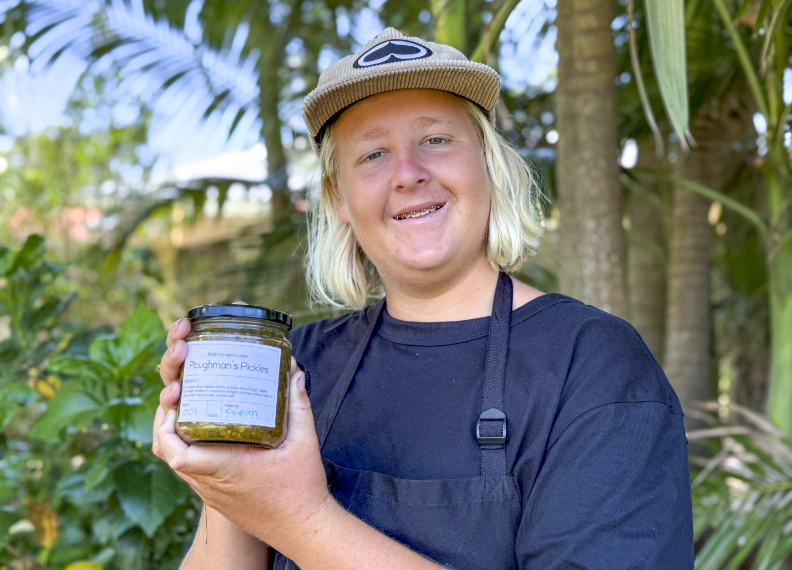 STEPS student holding a jar of Pathways to Plate Ploughman's Pickles