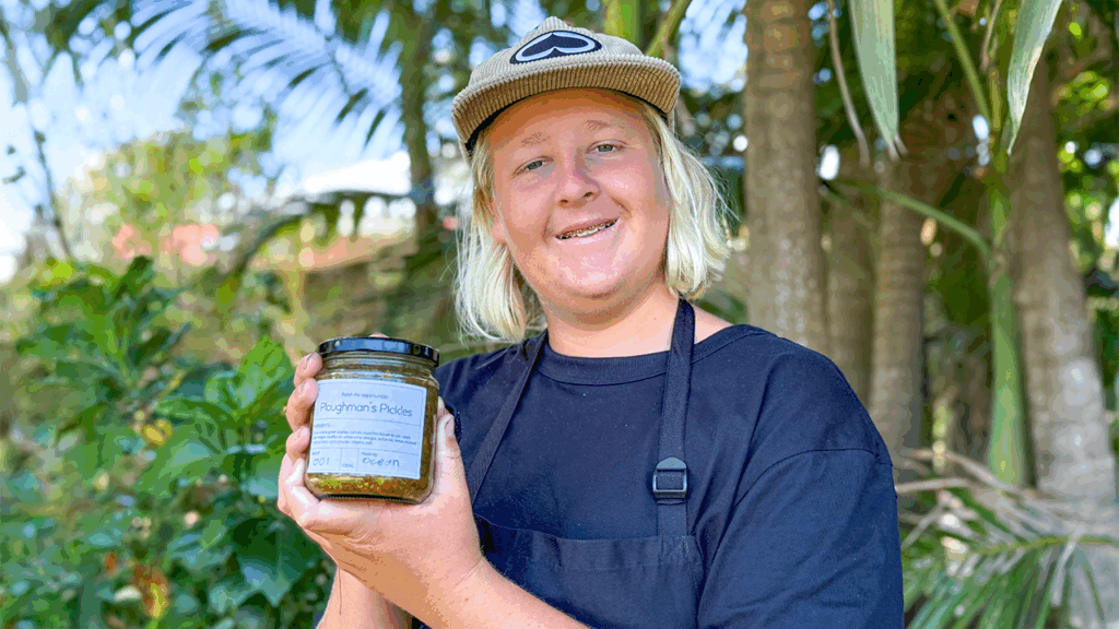 STEPS student holding a jar of Pathways to Plate Ploughman's Pickles