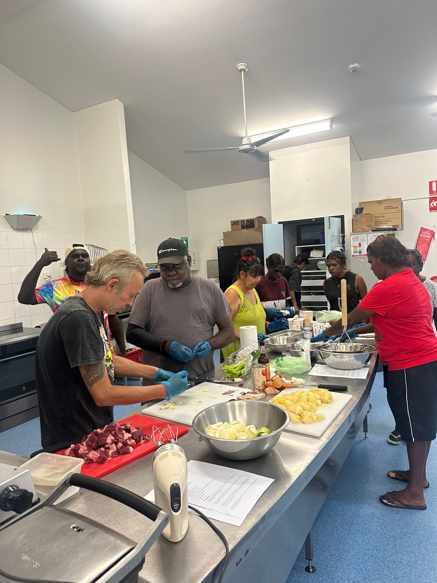 Client cooking a meal as part of the SEE program at STEPS