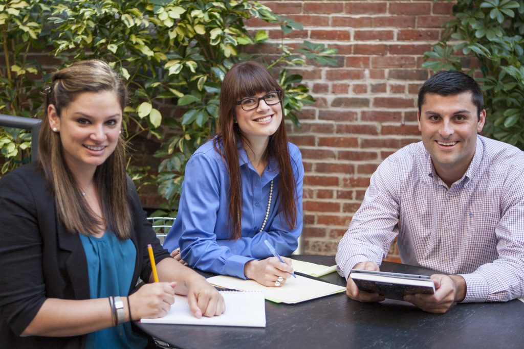 Three people studying