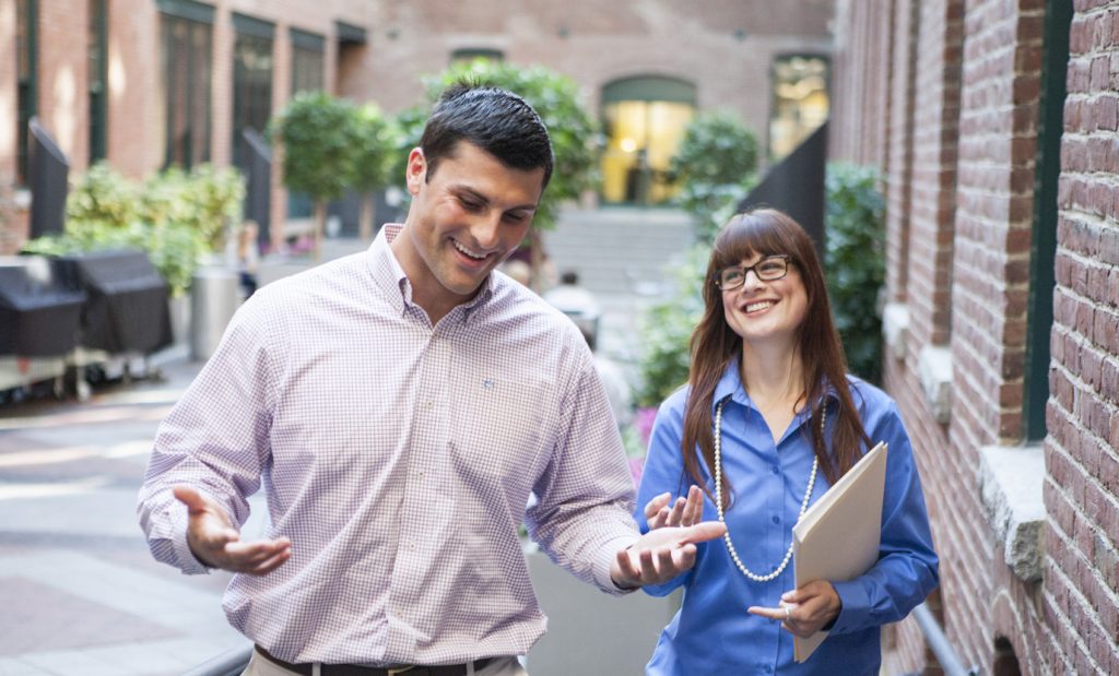 Smiling man and woman walk together