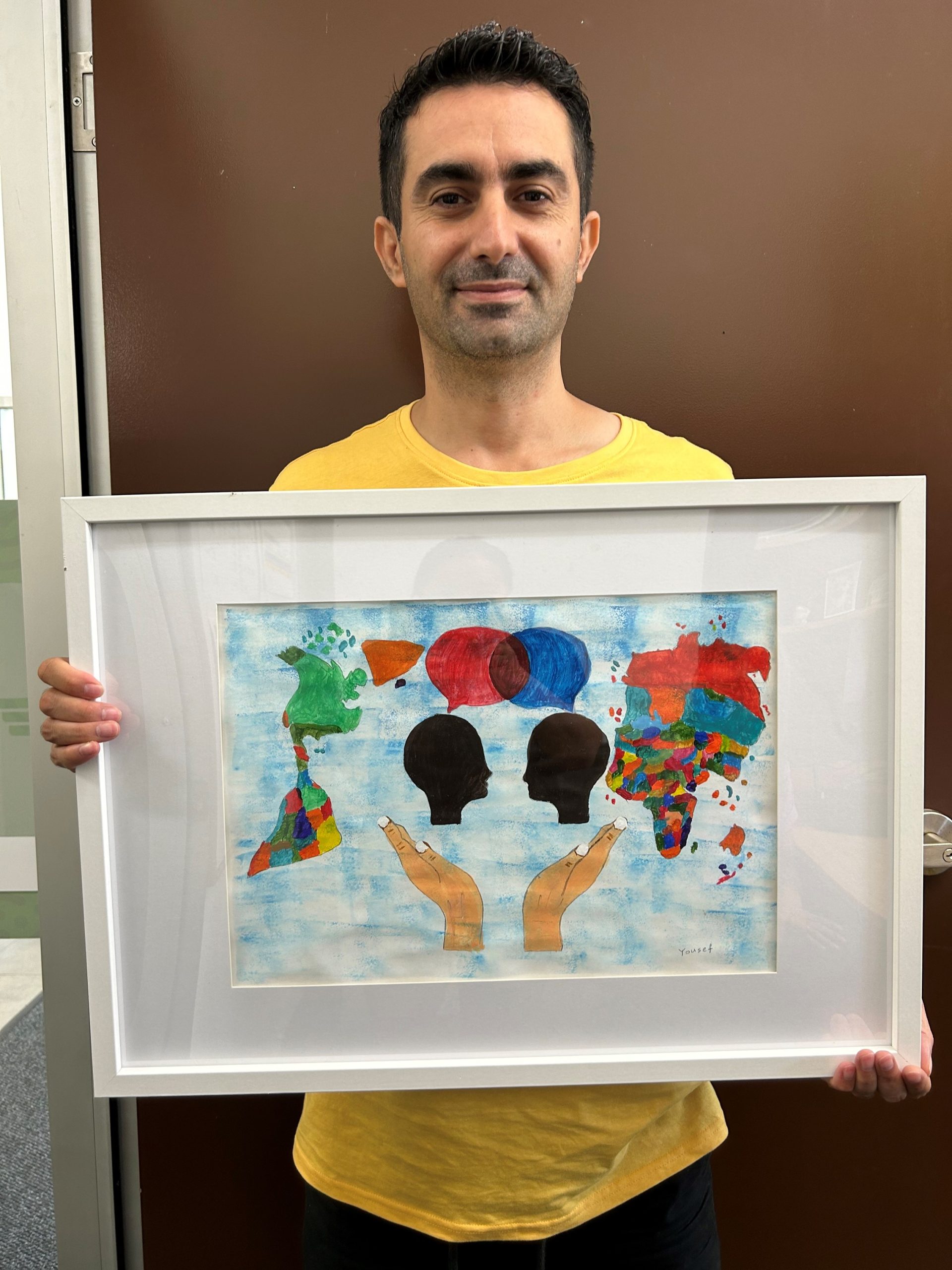 AMEP student at Palmerston and his artwork in the Darwin Community Legal Service's Human Rights Art Awards & Exhibition “Rights On Show.”